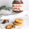 Nutella cookies with a jar of nutella